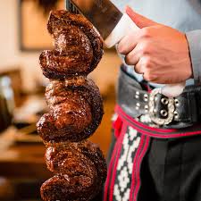 Rodizio Grill signature dishes Top SirloinParmesan SteakChicken HeartsBacon Wrapped Chicken